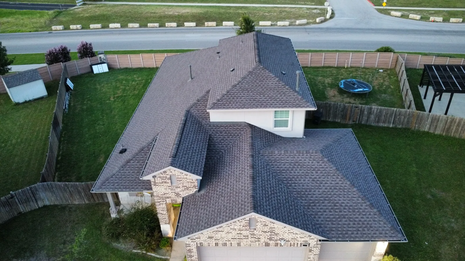 Completed roof replacement in Georgetown, Texas, GAF Timberline HDZ in Mission Brown, photographed from above after hail damage