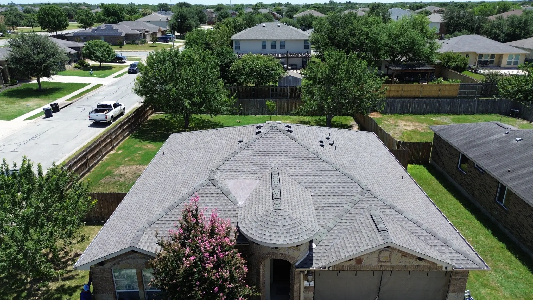 Completed gray architectural shingle roof replacement by Roof Royale aerial
