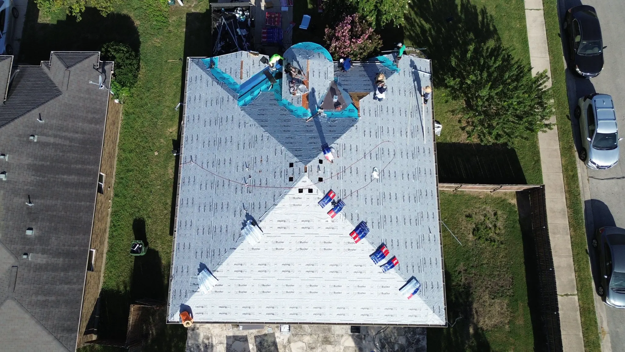 Roof Royale crew working on underlayment during a roof replacement aerial